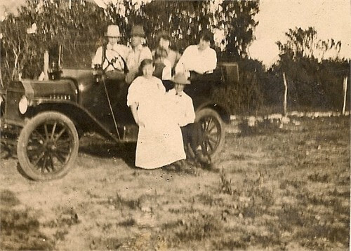 Johanson- Leonard Edythe Wilson on side of car